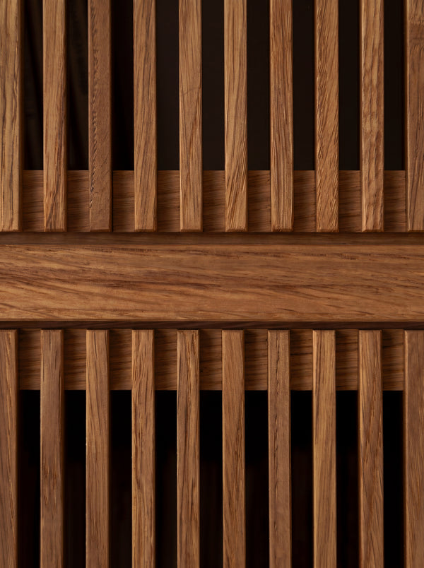 Macro of two fronts on MOLL in solid walnut, with vertical slats above and below a shelf edge