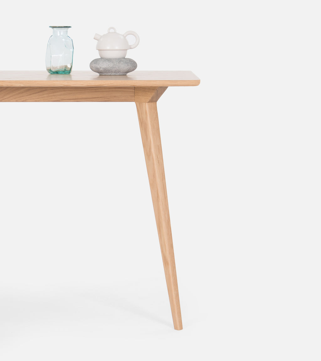  Wooden table with a vase and teapot.