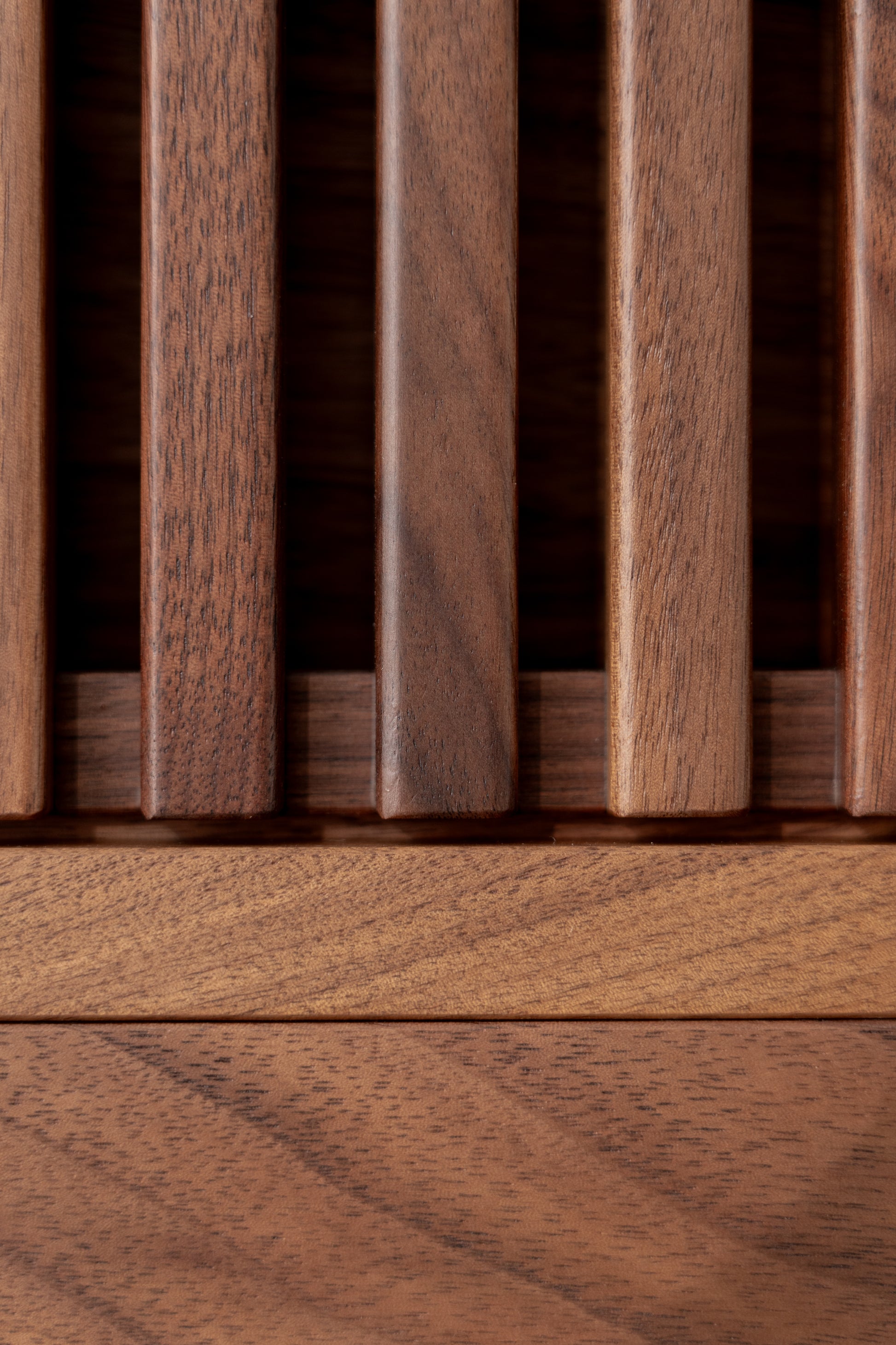 Close-up of vertical wooden slats with a smooth, polished finish.