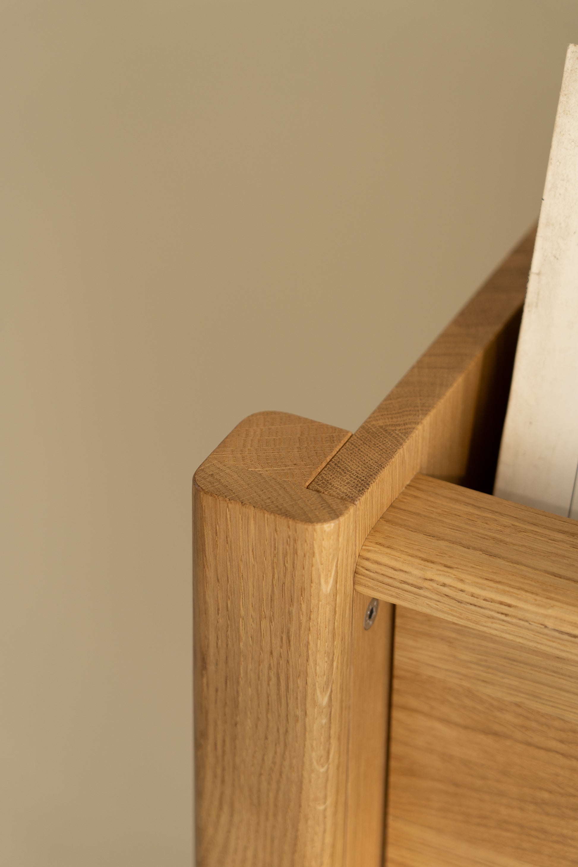 Close-up of a wooden table corner with smooth edges.