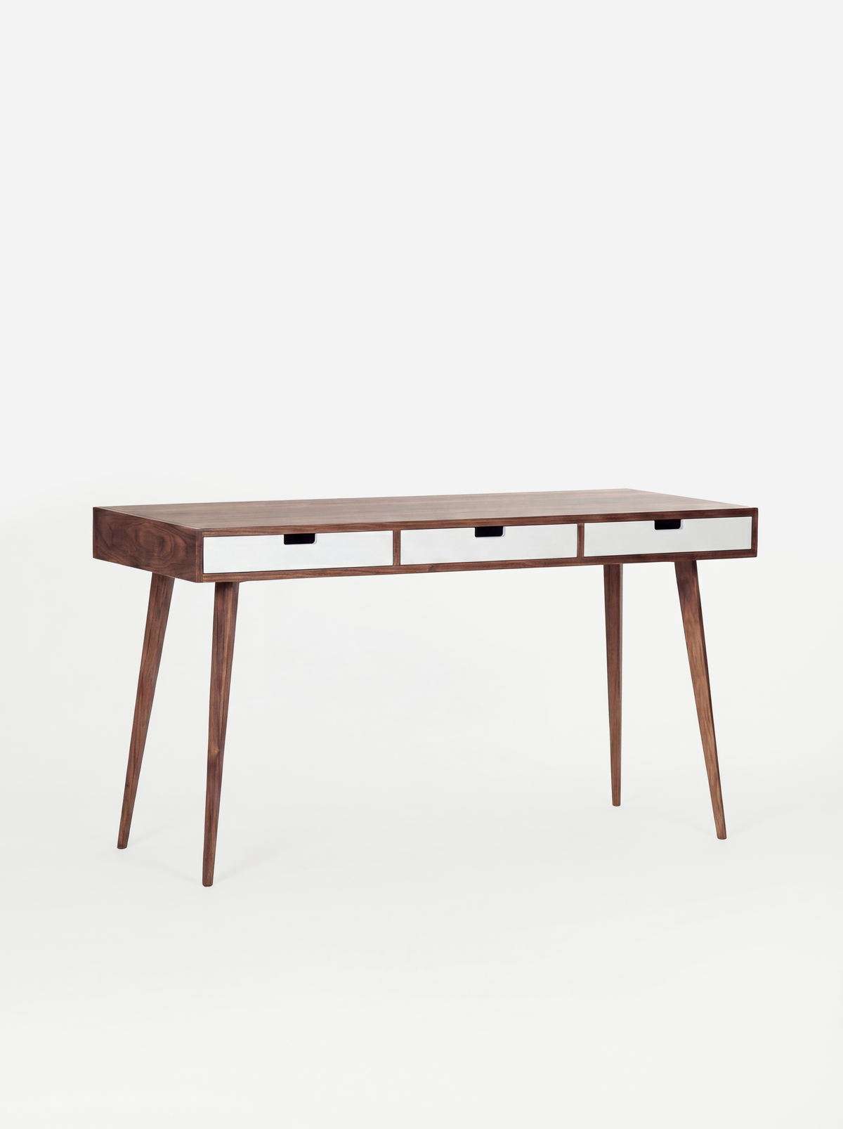 Three white drawer fronts on the empty HEIM 140 desk in walnut wood, viewed at an angle on a white background